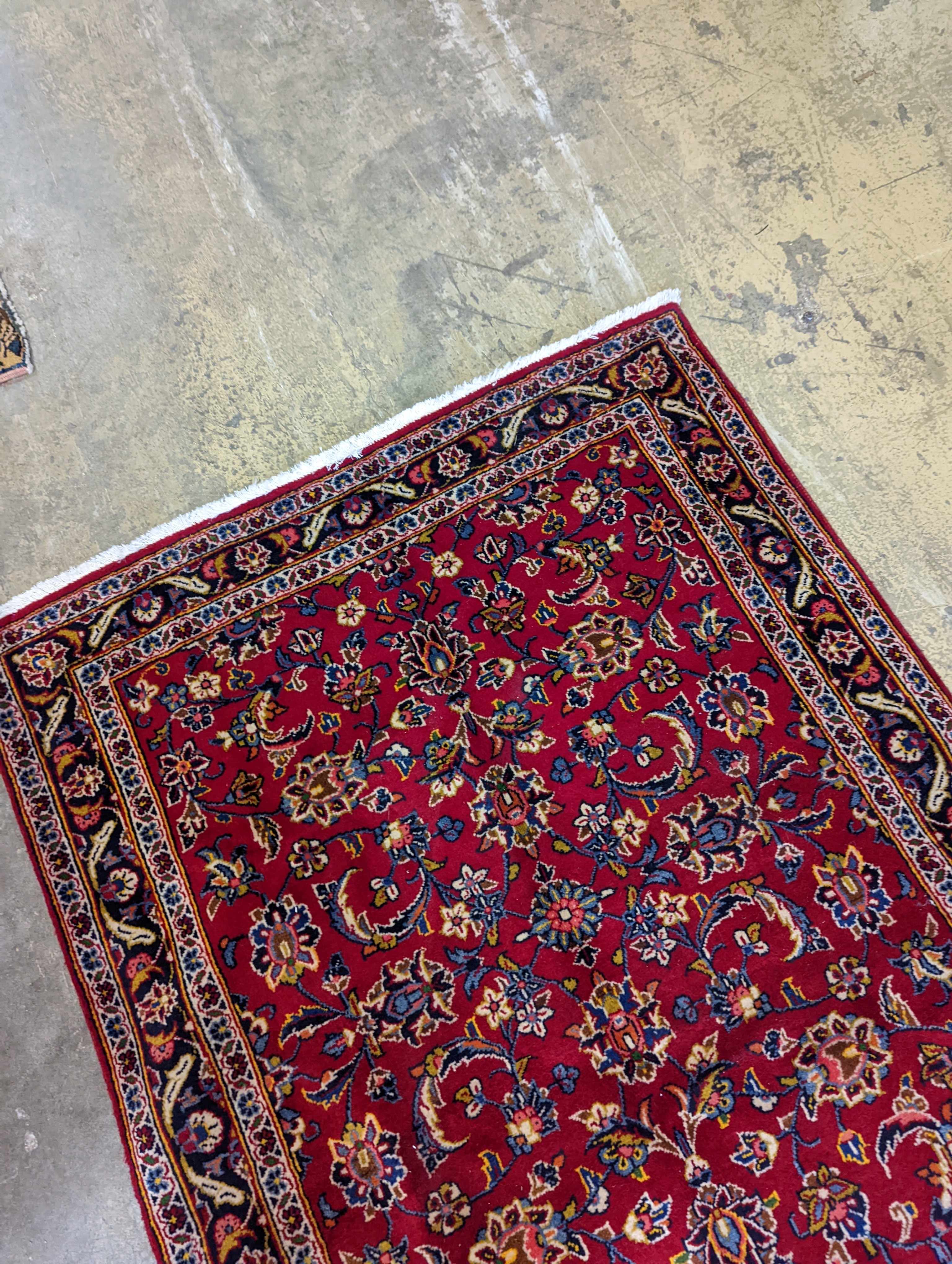 A Kashan red ground runner, 340 x 101cm